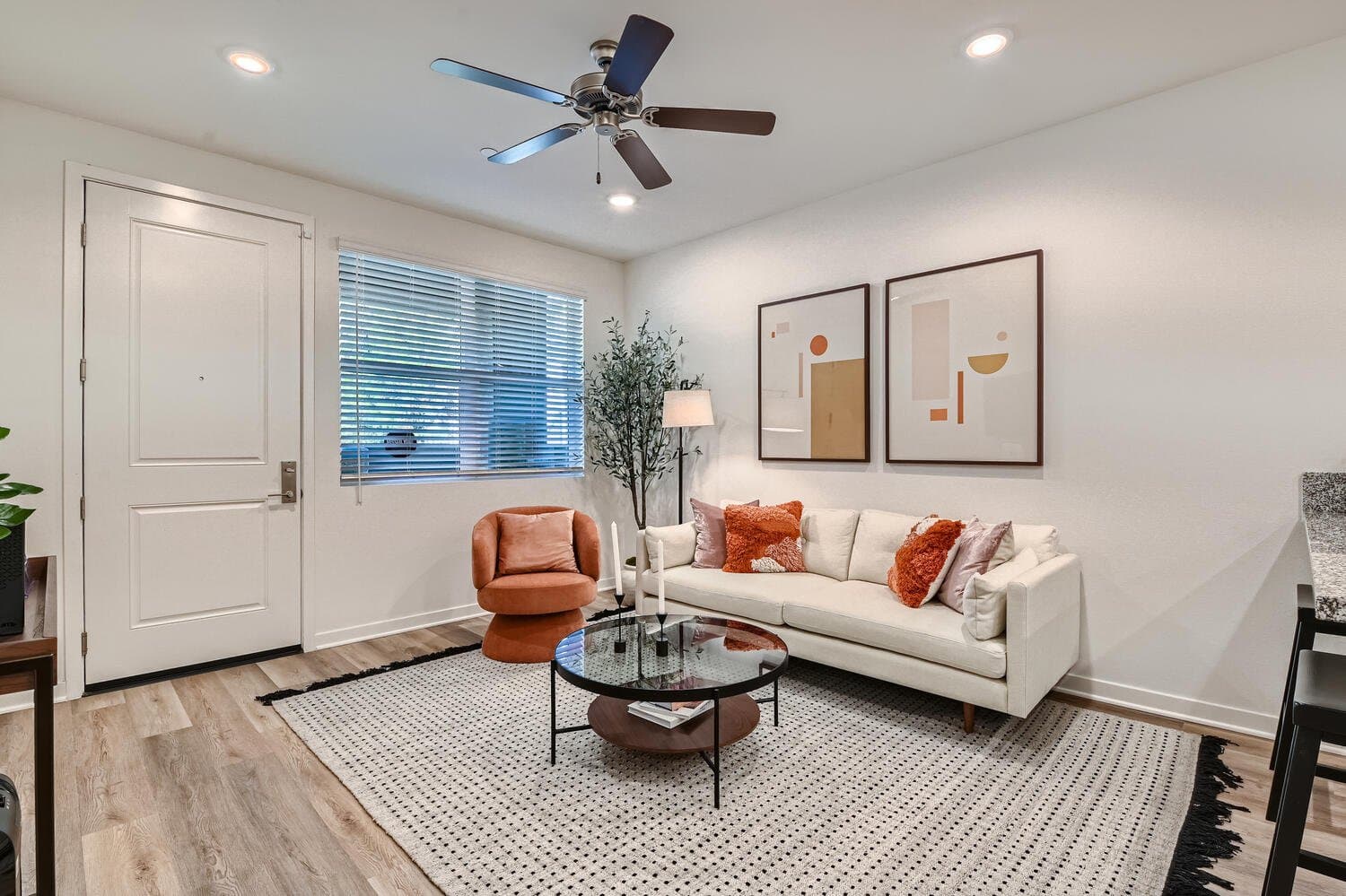 Living room with plank flooring and natural light