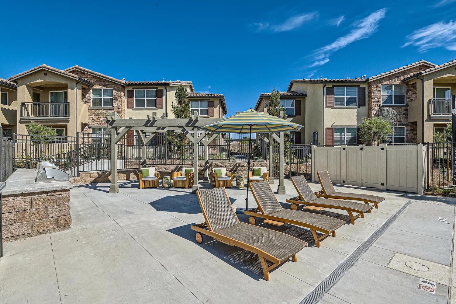 Trellis-covered picnic area by the pool courtyard